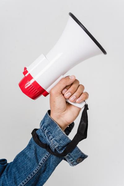 An arm holding a megaphone