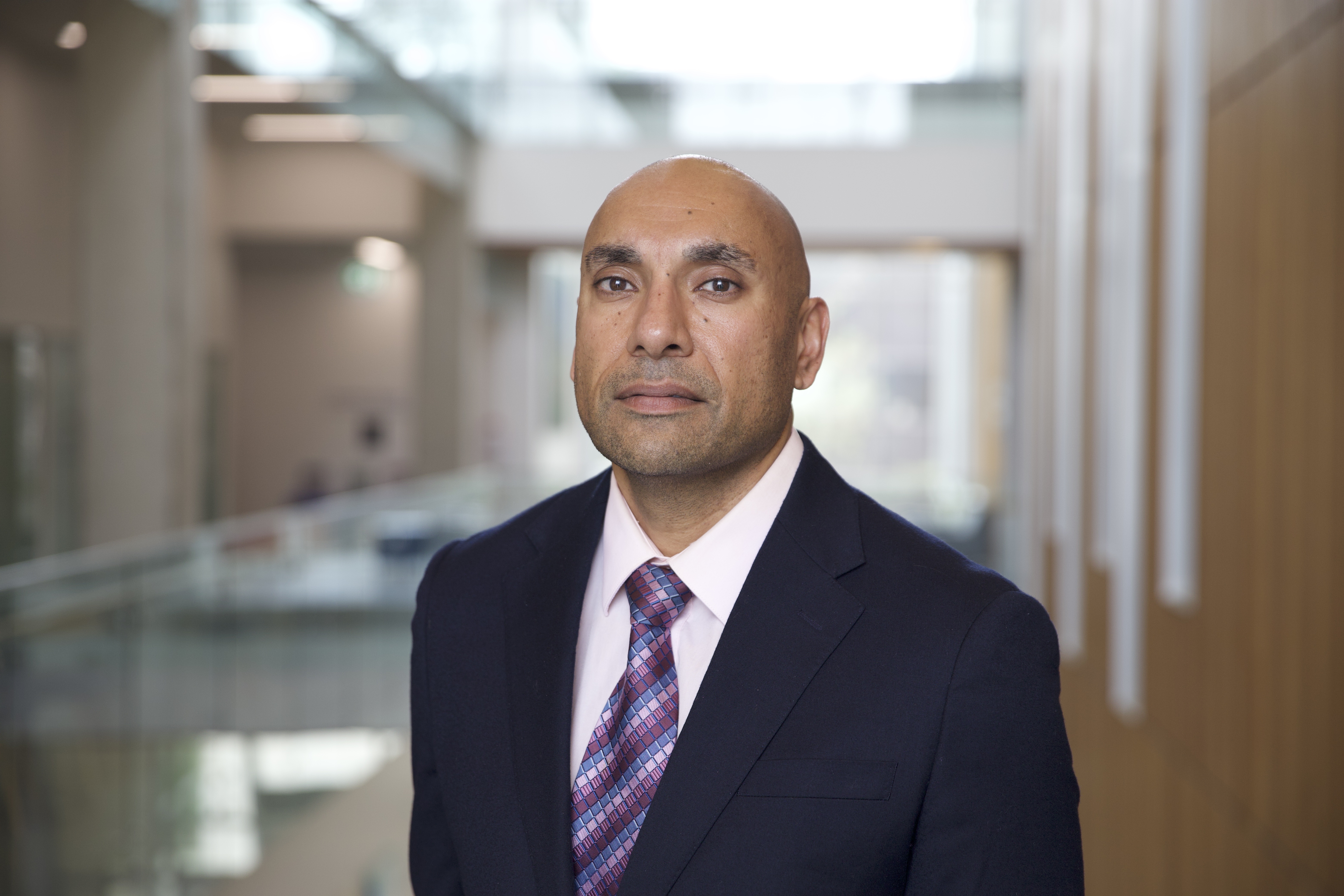 An image of Hardeep Chahal on a business-like background